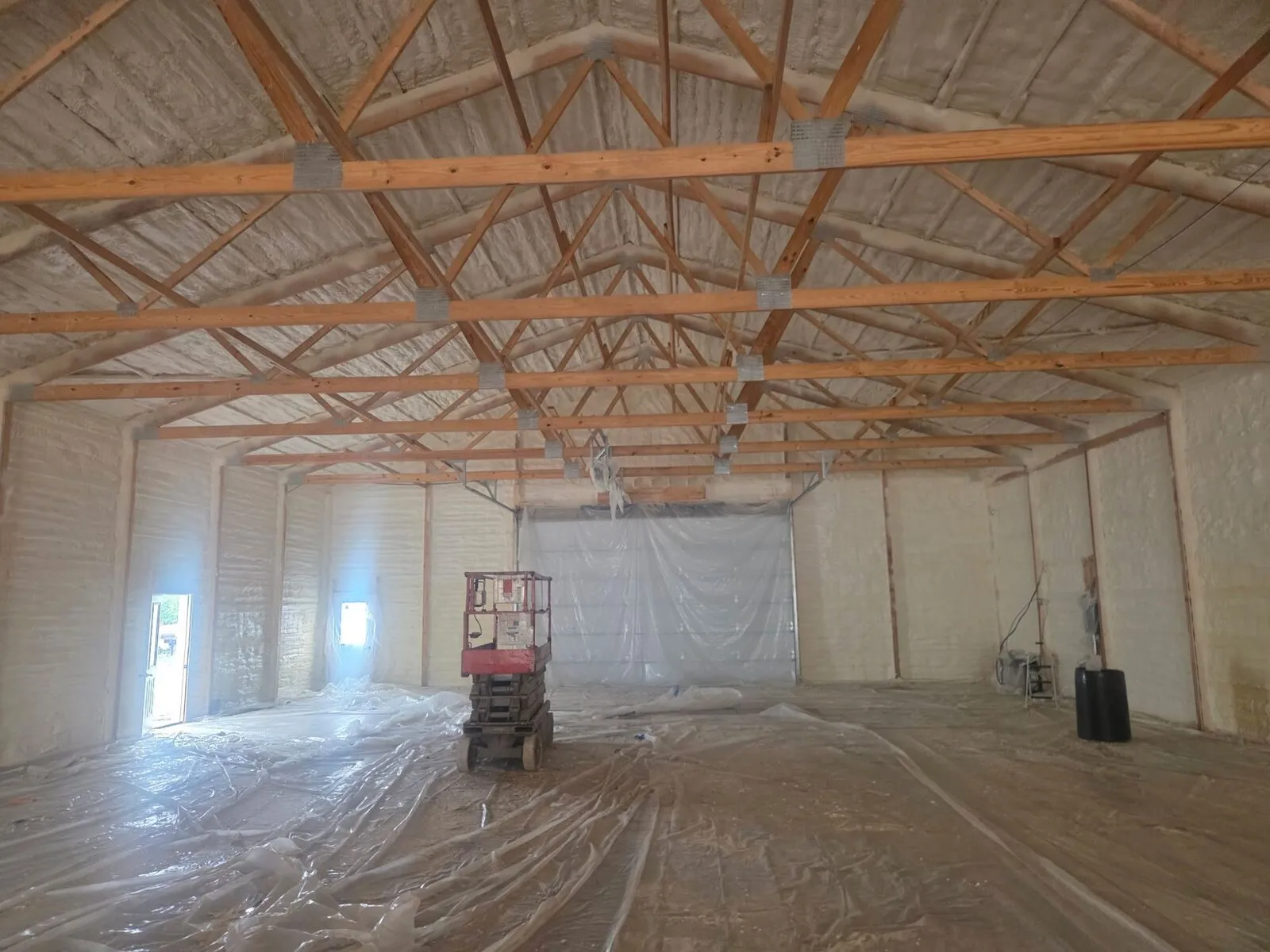 Closed-cell spray foam on the walls and roof deck of a large detached garage in northwestern Wisconsin